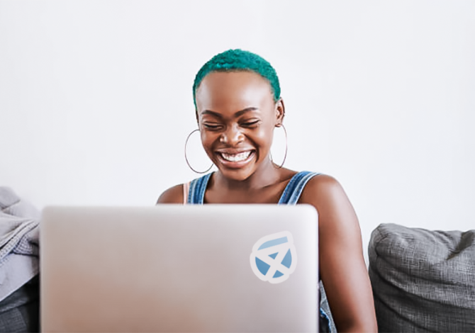 Woman smiling while using computer